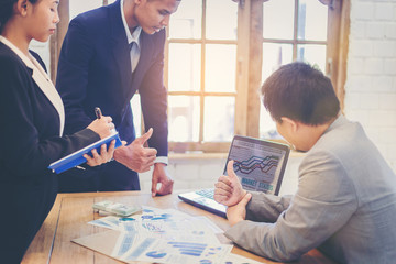 Successful business people group cheer up after presentation meeting in business plan.