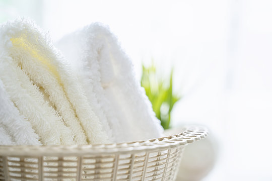 Close up view of towel in basket on white background