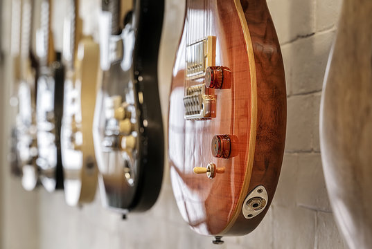 Closeup electric guitar hang on the wall