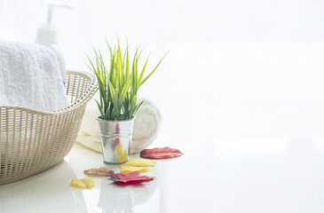 White towel in basket on white table