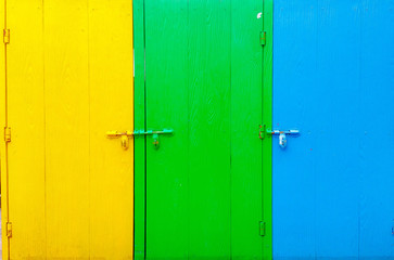 Tree wood doors in yellow green and blue