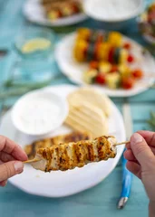 Fototapeten Delicious grilled chicken souvlaki, traditional Greek dish. © iMarzi
