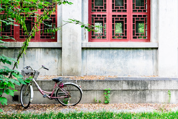 Fototapeta na wymiar bicycle parking near the red window