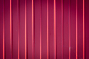 Red metal sheet metal profile as background