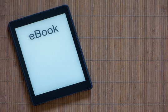An e-reader with white screen and text ebook
