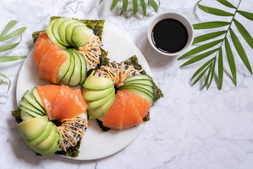 Sushi donuts with salmon avocado and cucumber