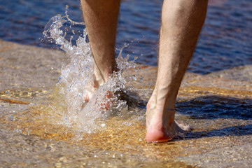 Feet in the water in a fountain