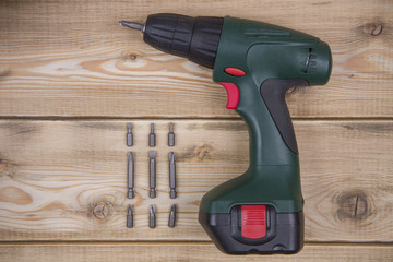 Screwdriver, tools on a wooden background. Top view. Copy space.