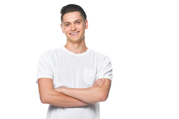 handsome smiling man standing with crossed arms in white shirt isolated on white