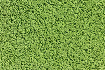 Decorative green plaster texture on the wall. Texture of the green stucco wall for background