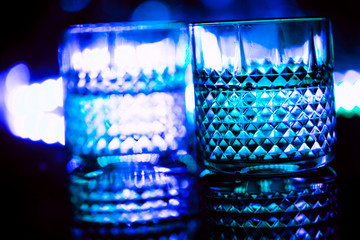 bar colored lights with glasses of alcohol