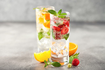 Summer drinks with strawberry and orange