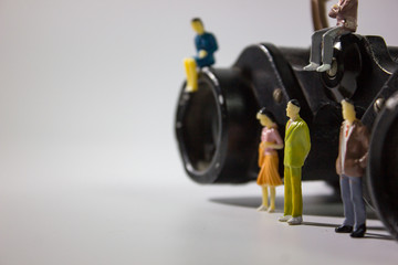 miniature business people with binoculars closeup.