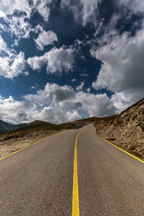 Empty road into the mountains