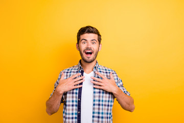 I won?! Young brunette man with an enthusiastic face look into the camera put his hands on his...