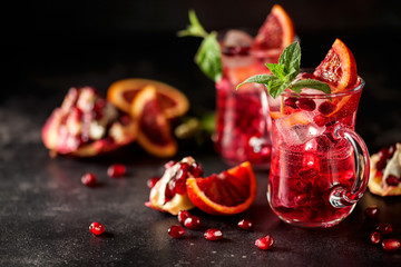 Red cocktail with blood orange and pomegranate.