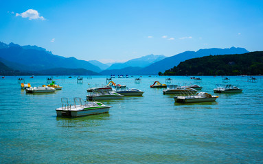 Fototapeta na wymiar Lake of Annecy with pedalo in the French region Rhone Alps during summer