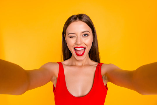 Hey there! Closeup portrait of beautiful pretty charming rejoicing joking cute beautiful stunning funky funny comedian comic lady taking making selfie isolated bright background
