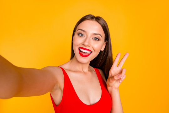 People person lifestyle facial emotion expressing delight concept. Close up photo portrait of pretty cute nice glad charming stunning lady giving v-sign isolated background