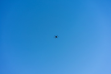 drone flying with blue sky low angle view
