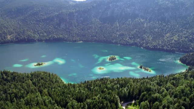 4K scenic flight of Eibsee in Bavaria on the bottom of Zugspitze the highest mountain in germany