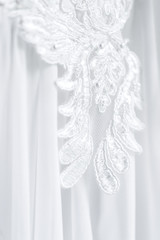 Lace embroidery on a wedding dress closeup