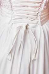 Details of white wedding dress closeup, view from back