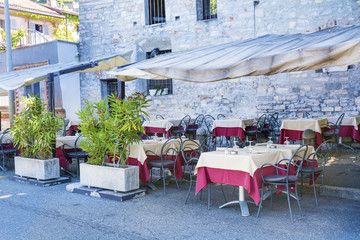 Italian Outdoor Restaurant with White Umbrellas in Italy 