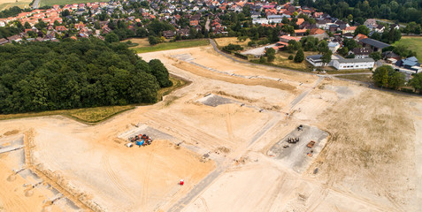 Aerial photos of the building site for the development of a new development area, which is en adjacent to the development of an old village centre