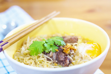 Instant noodle with pork and egg ready to be eaten - delicious instant food menu concept