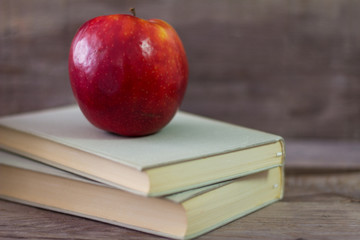 Books with apple. The concept of learning