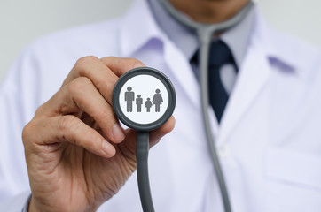 Doctor holding stethoscope, family medicine