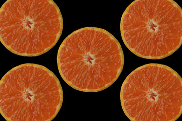 Orange slice on the black background.