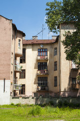 An old buliding with windows and balconies.