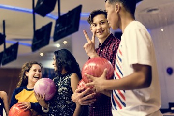 Friends bowling together after school - obrazy, fototapety, plakaty