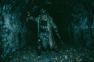 Survived in nuclear disaster and living in catacombs or city underground tunnels human creature,...