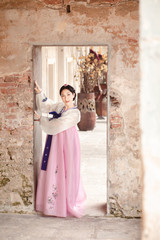 Woman wearing Hanbok, Korean traditional dress costume walk and travel in Seoul city, South Korea