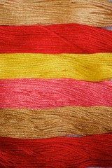 Threads of different colors and shades for embroidery and creativity.