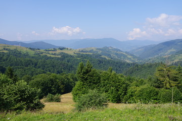 Obraz premium mountains of green and blue sky