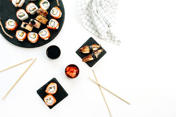 Sushi rolls on white background. Flat lay, top view.