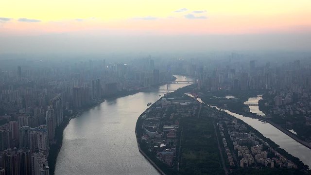 Guangzhou skyline with the Pearl River at dusk. Guangdong, China