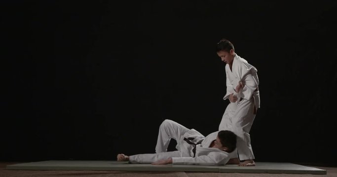 Judo throw technique on black background