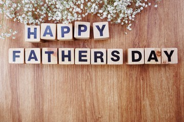 happy fathers day alphabet letters on wooden background