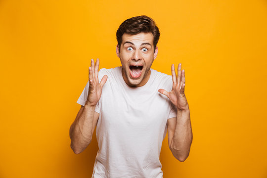 Portrait of an excited young man celebrating success