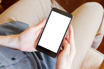 man holding and using mobile phone