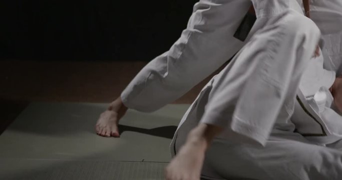 Judo throw technique close up handheld camera