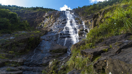 A huge waterfall in Vietnam's national park Bachma. Bottom view.