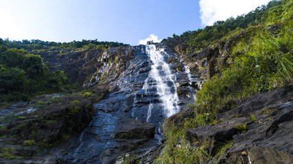 A huge waterfall in Vietnam's national park Bachma. Bottom view.