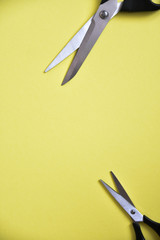 scissors on yellow background
