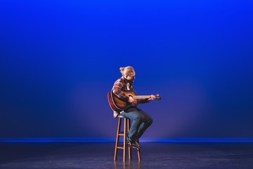 Man playing guitar on stage